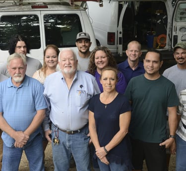 a group of people standing in front of a van