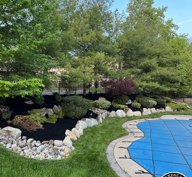 excellent landscaping and hardscaping of grass, stones and trees by NP Landscaping