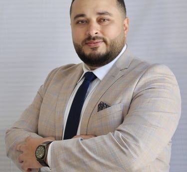 a man in a suit and tie with a watch on his wrist