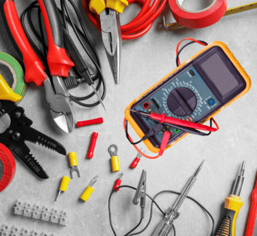 a bunch of electrical tools that are on a table