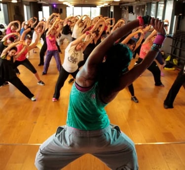 zumba lesson, a group of women combining dance and exercise