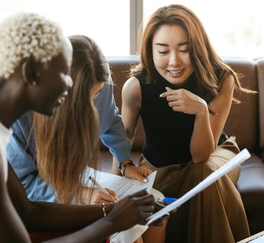 Group of multicultural women speaking and setting accountability goals