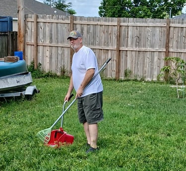 Robert working on removing pet waste from customers yard