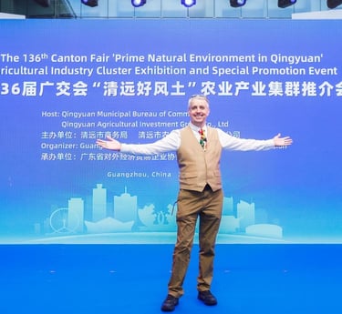 a man standing in front of a banner that says, the man is holding a