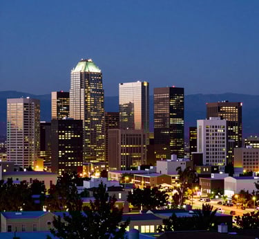 Investigator reviewing documents with cityscape of Albuquerque visible through the office window.