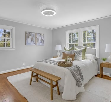primary bedroom in ranch in mauldin staged by staging house