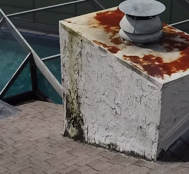 Severe stucco failure and water damage on New Port Richey Florida chimney before repair