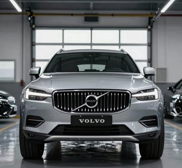 A sleek black sports car parked under soft lighting, highlighting its polished curves against a dark background.