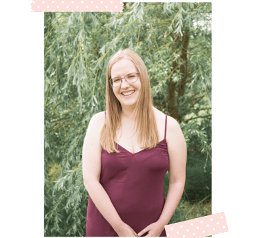 blonde woman in a burgundy dress - owner of a pop of colour designs