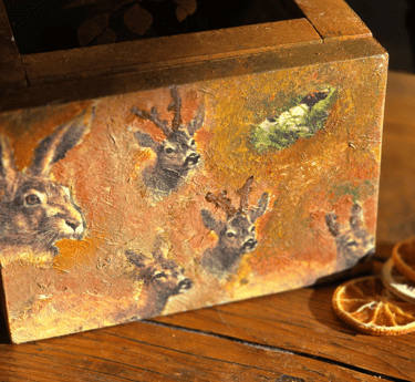 A vintage wooden box upcycled and with country animals, paint blended in using cosy autumn colours