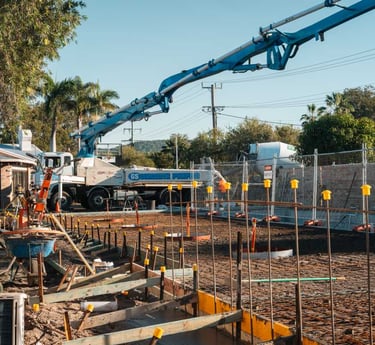 a crane lifts a crane to the top of a building