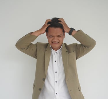 a man in a suit and white shirt