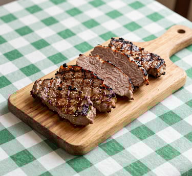 roasted ribs with sliced tomatoes and potatoes