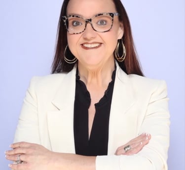 Professional headshot of Brandy Capps owner of Resiliency & Rainbows Counseling wearing a white coat