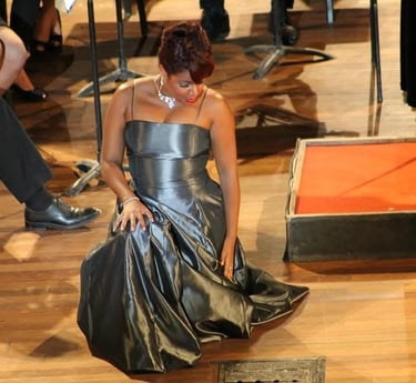 a woman in a silver dress with a dress on