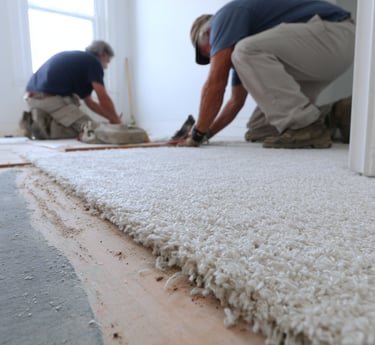 Professional carpet installers from Next Floors LLC working in Katy Texas home
