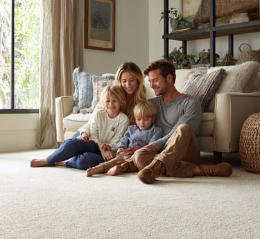 Satisfied Next Floors LLC customers enjoying new carpet installation in Katy home