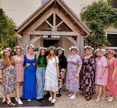 a group of hens showing off their flower crowns