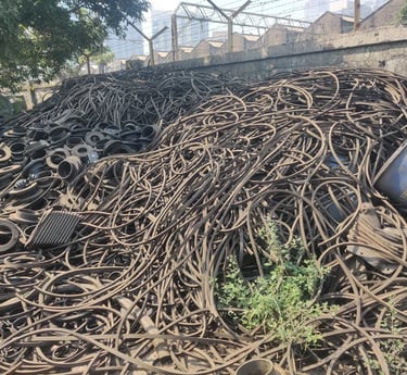 pile of timing belts in a landfill