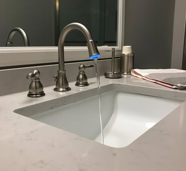 a sink with a faucet and a towel