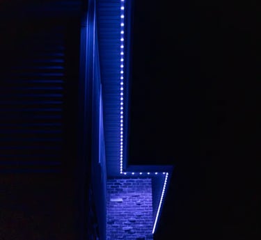 closeup of the house with the lights on the soffits