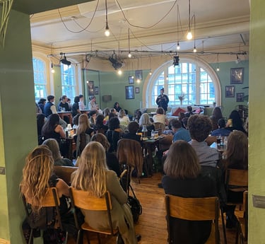 Rachel Long reading poetry at the Battersea Arts Centre during an event hosted by The Writing School