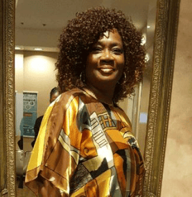 a woman in a dress looking at camera 