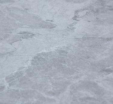 A soft stone slate with intricate gray and silver textures, combining elegance and versatility