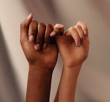 Agape Women holding hands together for empowerment 