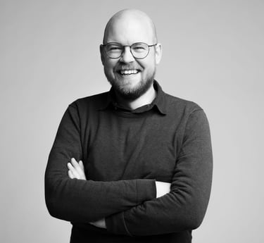 a man with a beard and glasses on his face