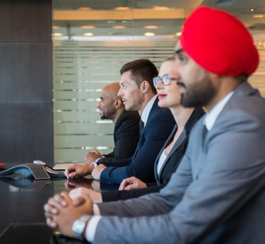 a group of business people sitting at a table