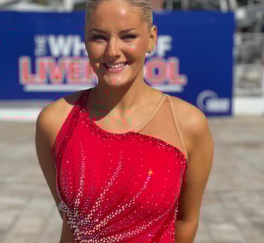 a woman in a red dress with a red dress, also called twirling outfit
