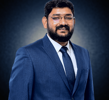 a man in a suit and tie with a beard