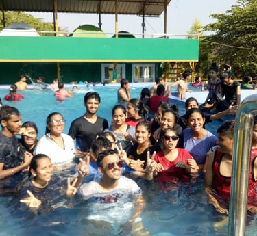 a group of people standing in a pool