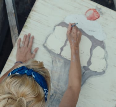Marla paints the ice cream sign