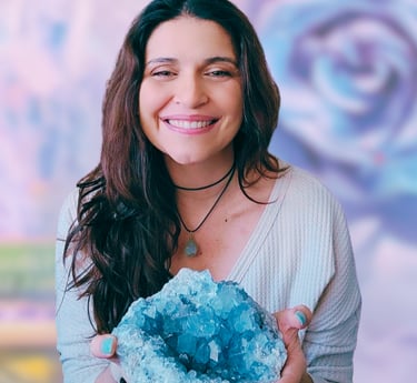 Veronica Dennis holding a large blue crystal stone