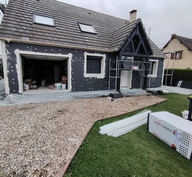 a house with a garage door and a garage door