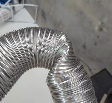 Kink in dryer vent hose.