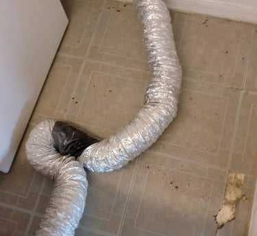 A dryer vent hose that was improperly repaired
