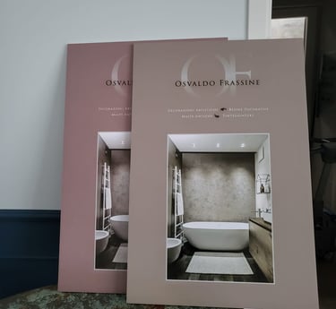 Osvaldo Frassine decorative resin catalogs showcasing modern bathroom interior design and wall finishes.