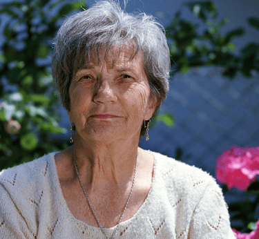 a woman in a white sweater and a necklace with a necklace
