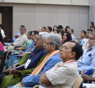 a group of people sitting in chairs in a room