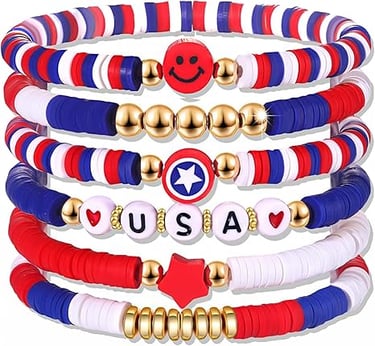 Stacked red white and blue patriotic clay bead bracelets with USA charms and gold accents.