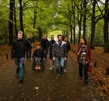 an Awe Academy team walking down a path in a forest