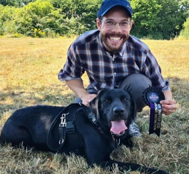Geoff Bunce and his Dog Raven getting a distinction for UK Sniffer Dog testing
