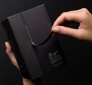 Product photography - a person holding a black box of honey