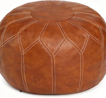 Round brown faux leather Moroccan pouf ottoman with decorative white stitching for home decor.
