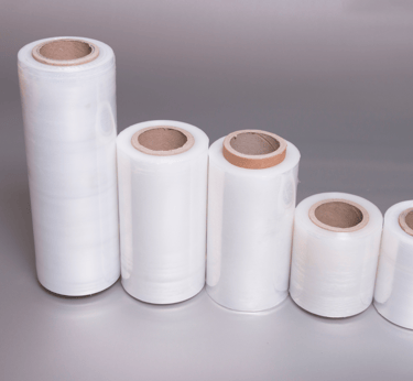 a group of white plastic stretch rolls wrappers with a variety of different sizes and colors