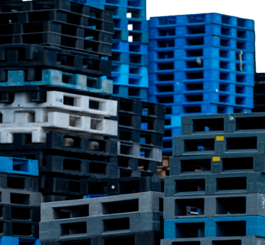 a bunch of crates of plastic pallets