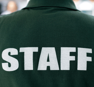 a staff staffer in a green uniform